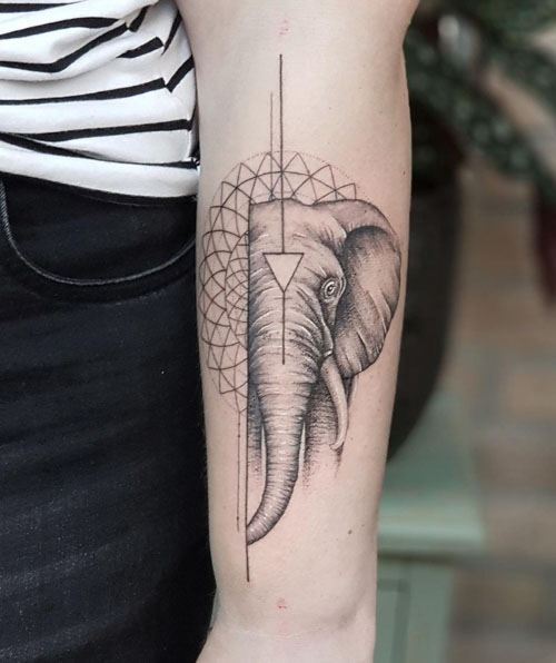 Abstract elephant tattoo located on the inner arm