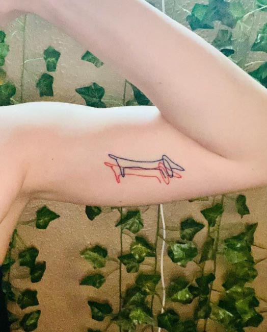 Minimalist cat and dog tattoo in line art