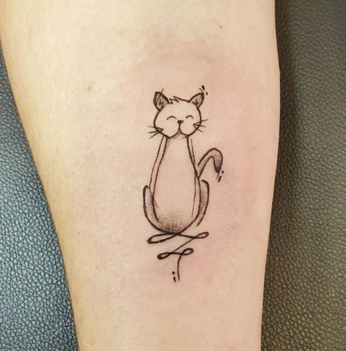 Sketch work cat tattoo on the inner forearm