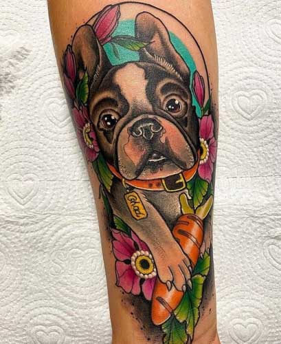 colorful frenchie tattoo holding carrot
