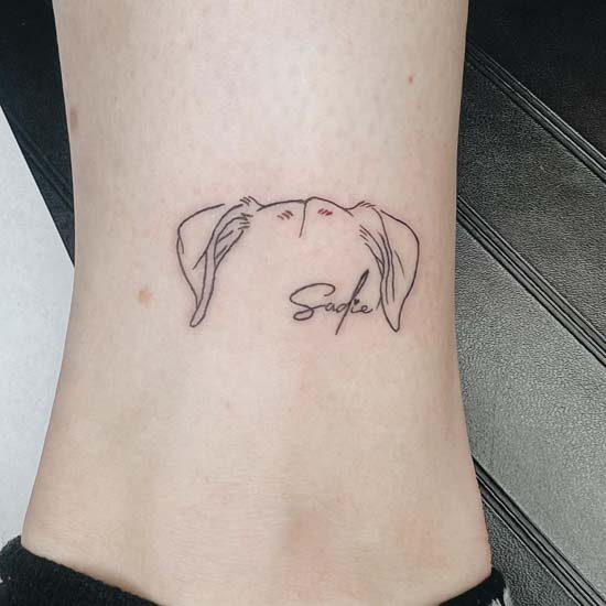dog head outline tattoo