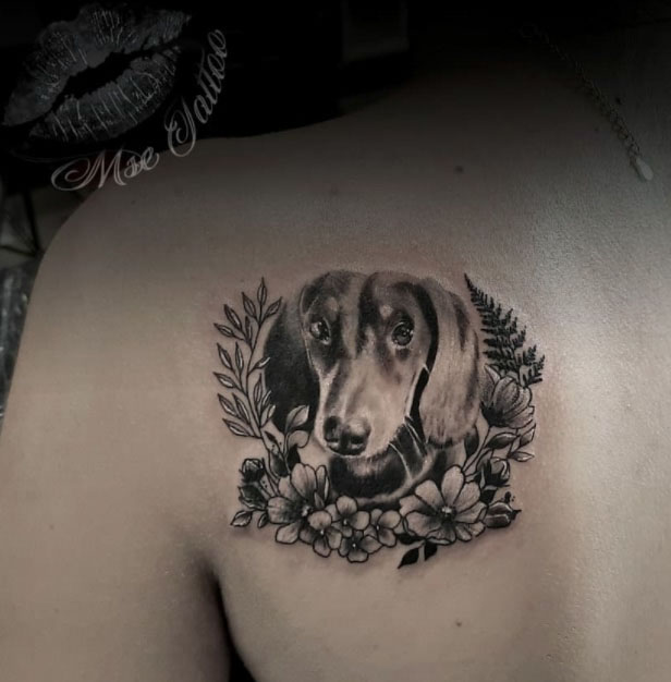 floral wiener dog tattoo on shoulder