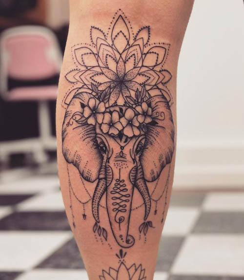 Elephant tattoo on the left thigh