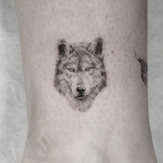 minimal small wolf tattoo