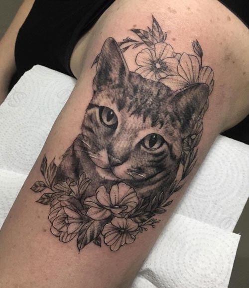 Microrealistic cat portrait tattoo on the tricep