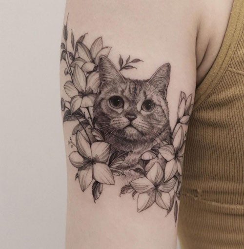 Black cat with flowers by Jessica Channer at Tattoo People Toronto ON  r tattoos