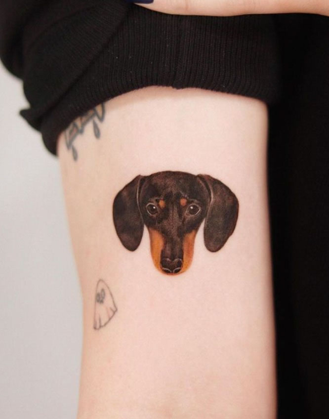 simple head tattoo of dachshund