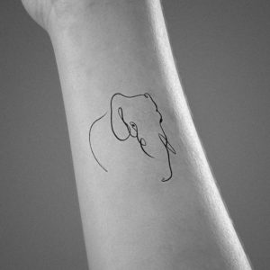 tiny elephant line tattoo
